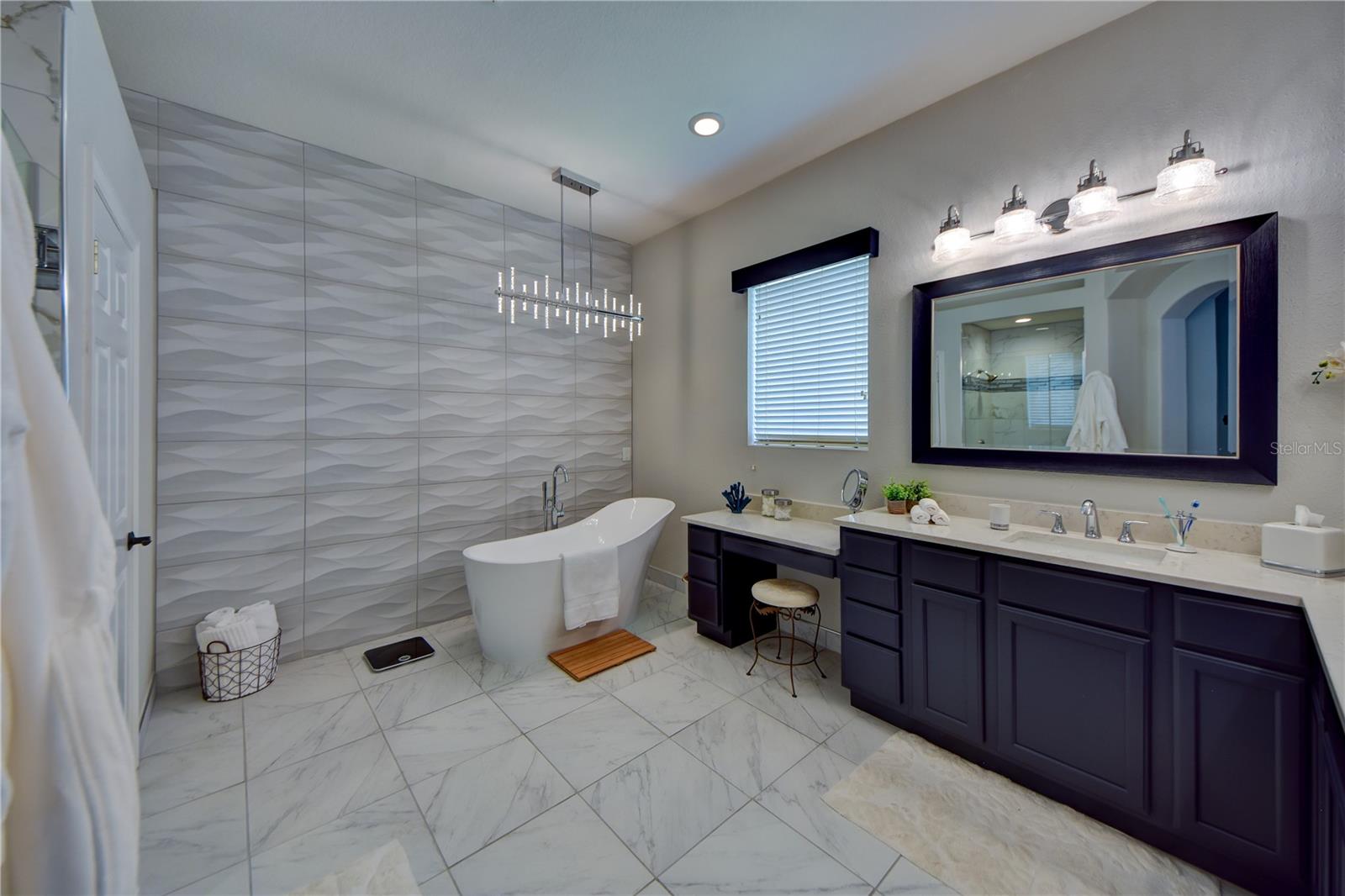 Beautifully Remodeled Spa Like Primary Bathroom With His/Hers Sinks And Soaker Tub