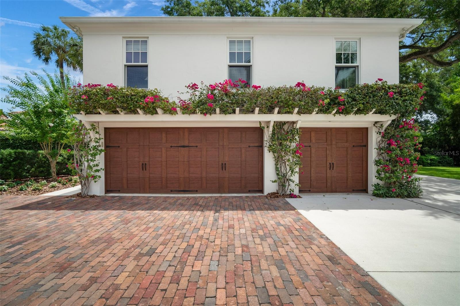 THREE BAY GARAGE PLUS GOLF CART BAY