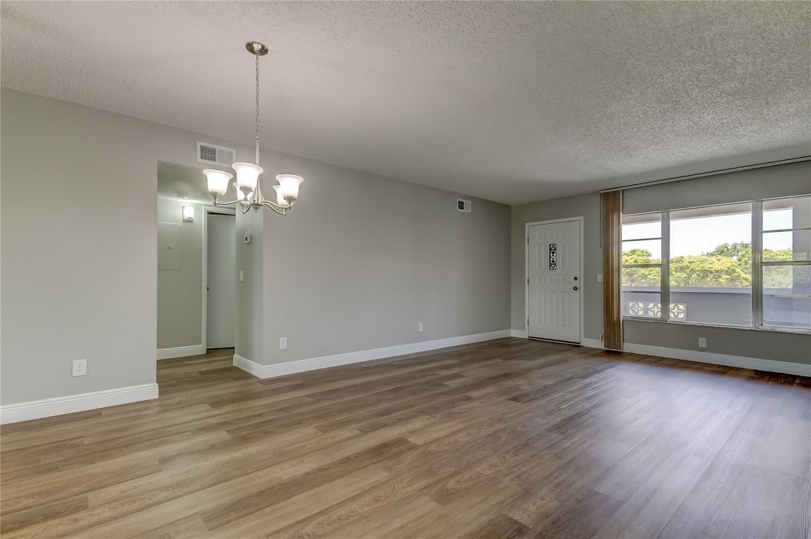 View to Front Door and Hallway from Dining Room/Living Room