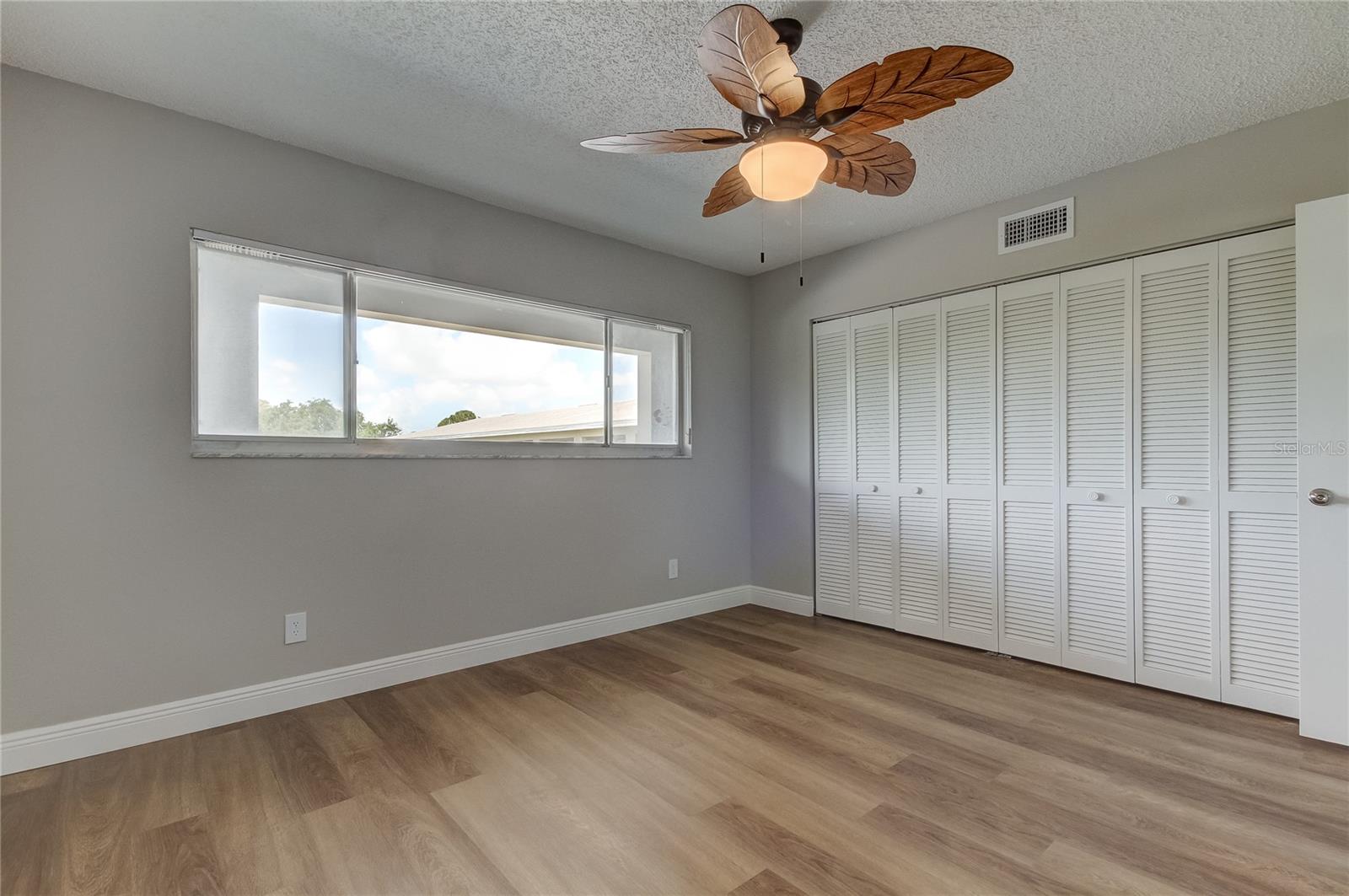 Second bedroom has large closet with new shelving