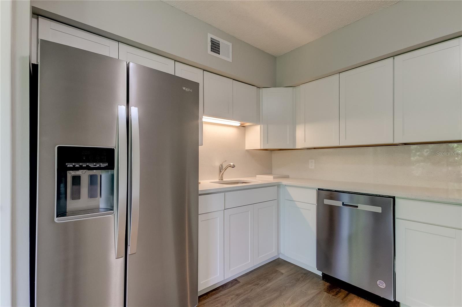 Side-by-side refrigerator with ice and water, new kitchen sink and faucet...new everything in kitchen!