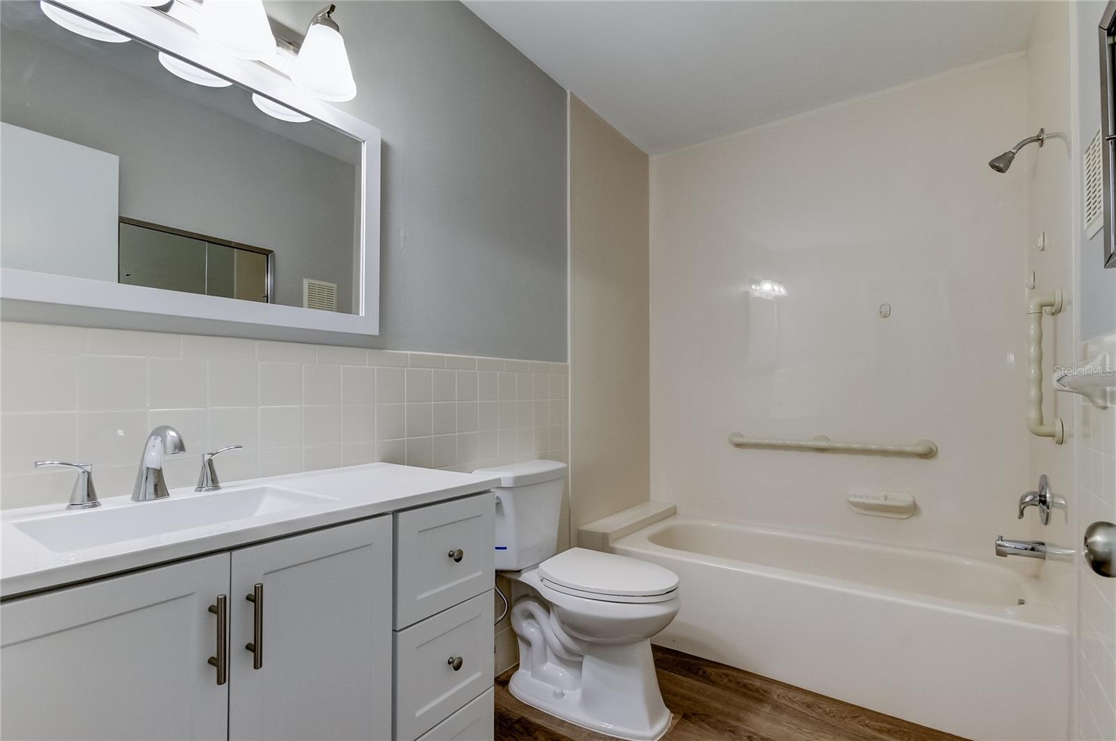 Guest bath with tub/shower, new vanity, new faucets