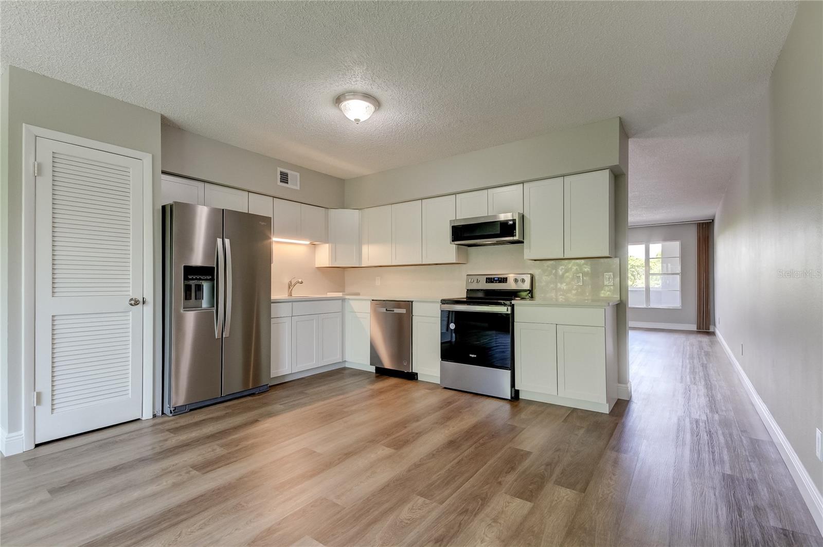 Open design Kitchen and Family Room with closet pantry