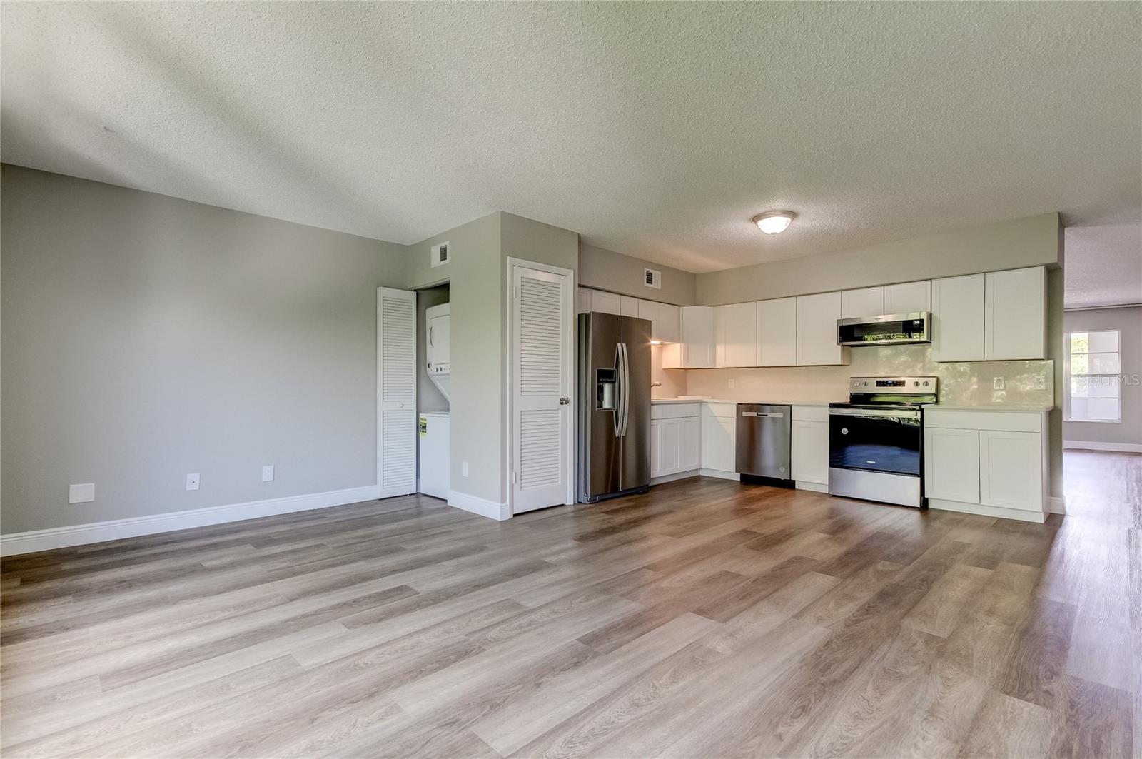 Lots of room in your Family Room/Kitchen.  Note the stackable washer/dryer.