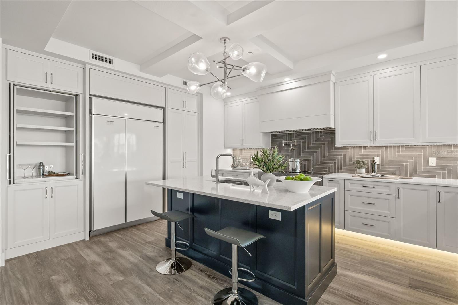 Here, you can see the coffee bar station. The refrigerator will be paneled to match the cabinetry...