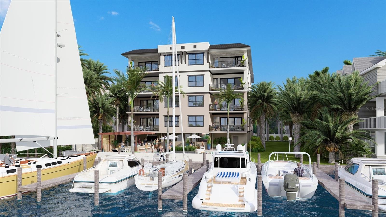 Water views from every residence at Quiet Cove. Every residence is considered a corner unit. You can see here the Carriage house, which is where a fitness center will be, and the individual climate-controlled storage units....