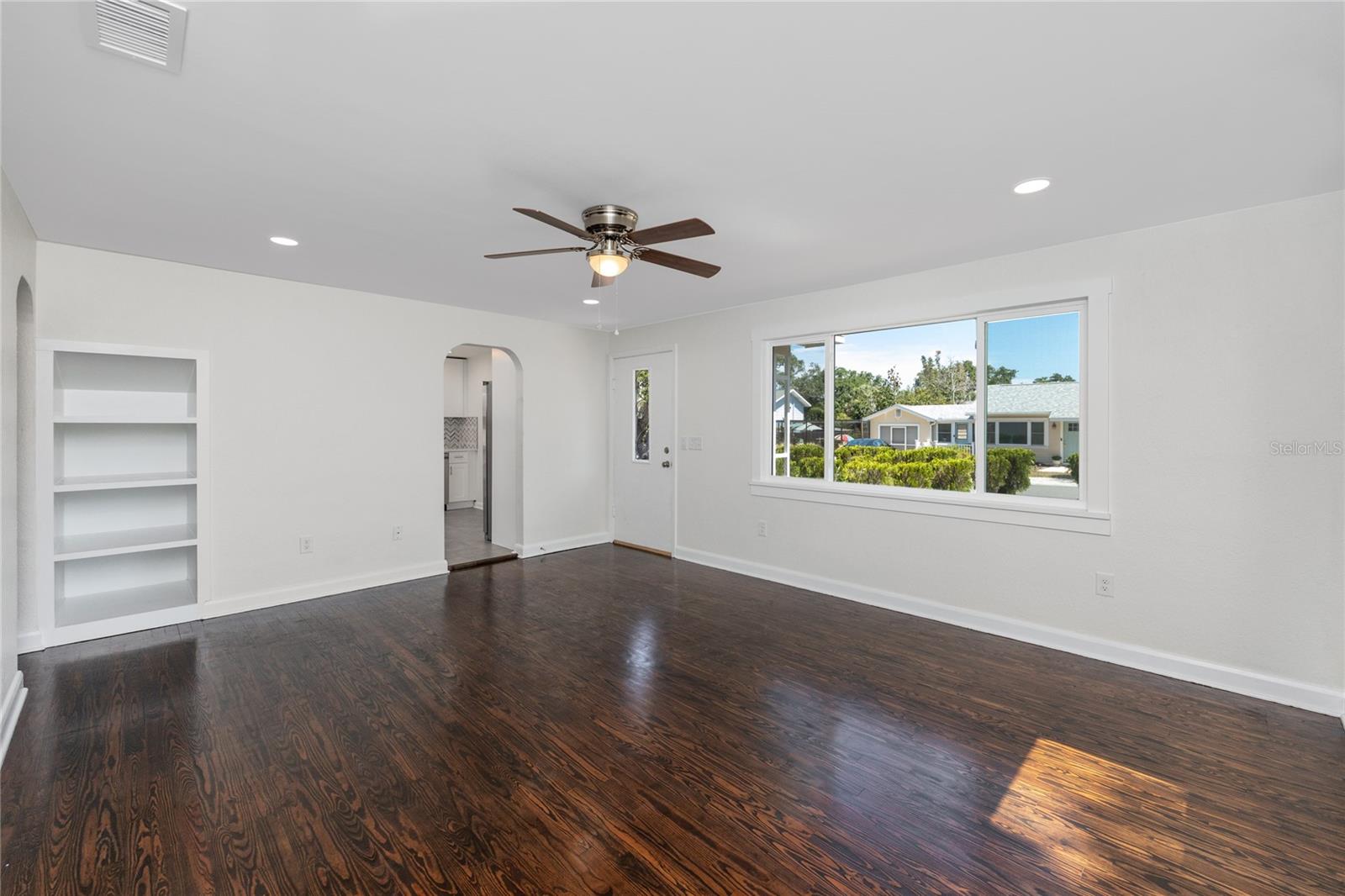 When you walk into the main house, you step into the spacious living room with refinished pine floors