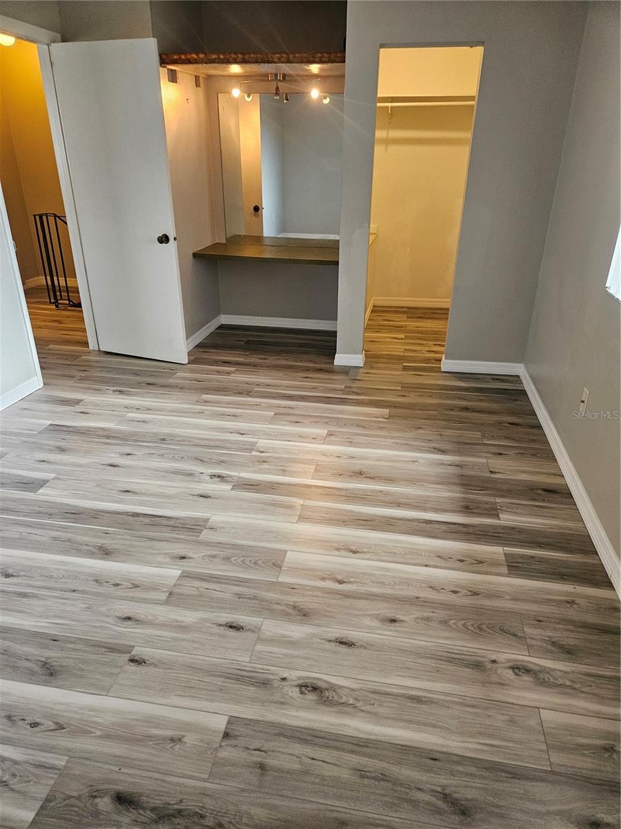 Primary Bedroom with walk in closet and makeup area.