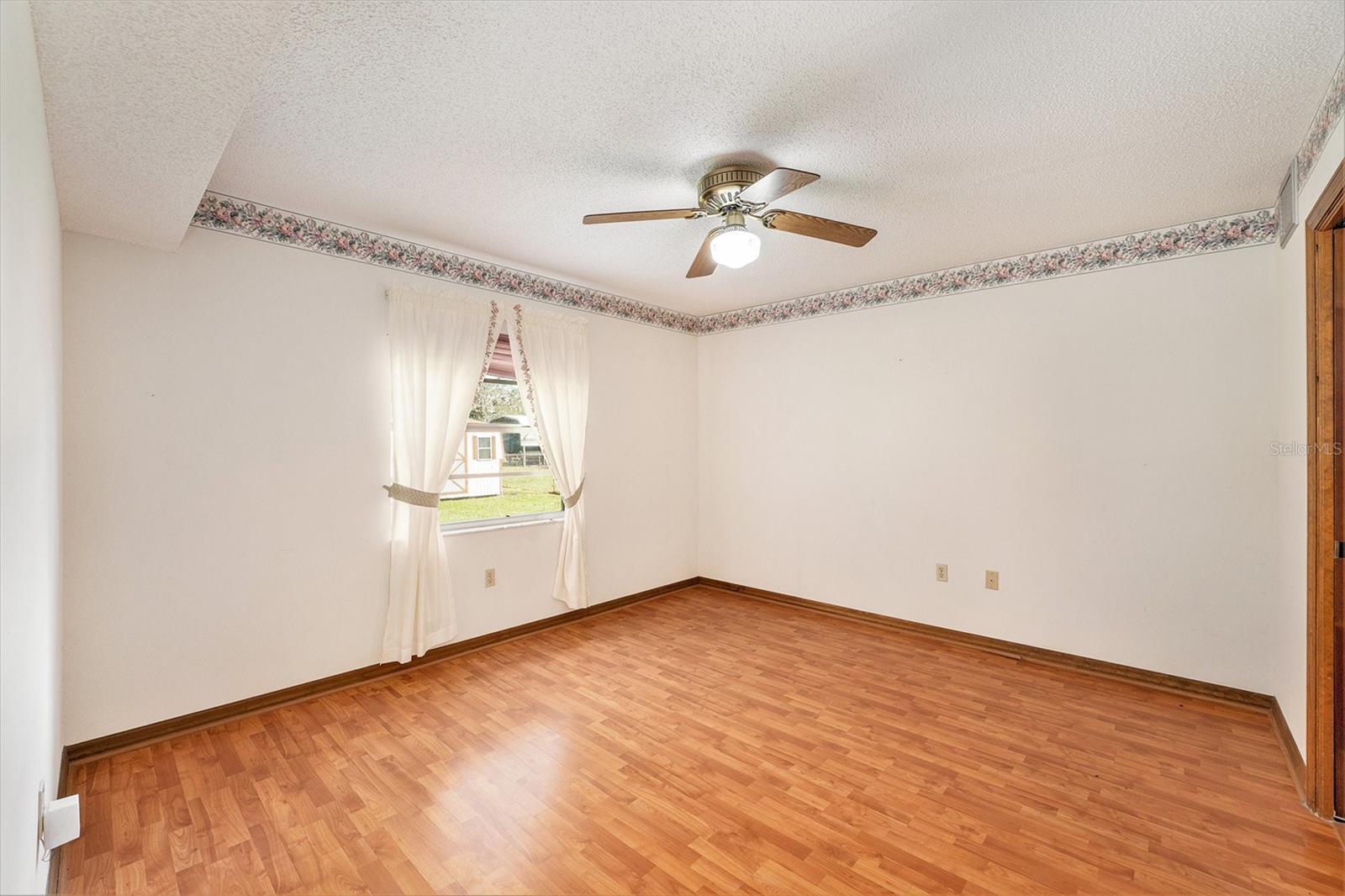 Primary bedroom overlooking the back yard