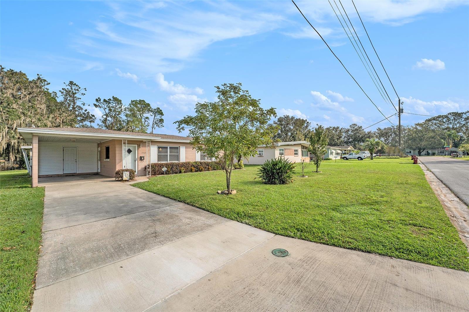 Long driveway and covered carport