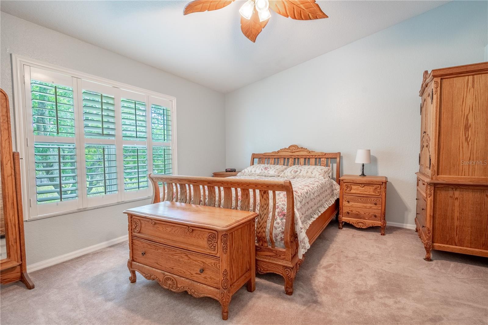 The primary bedroom features a vaulted ceiling.