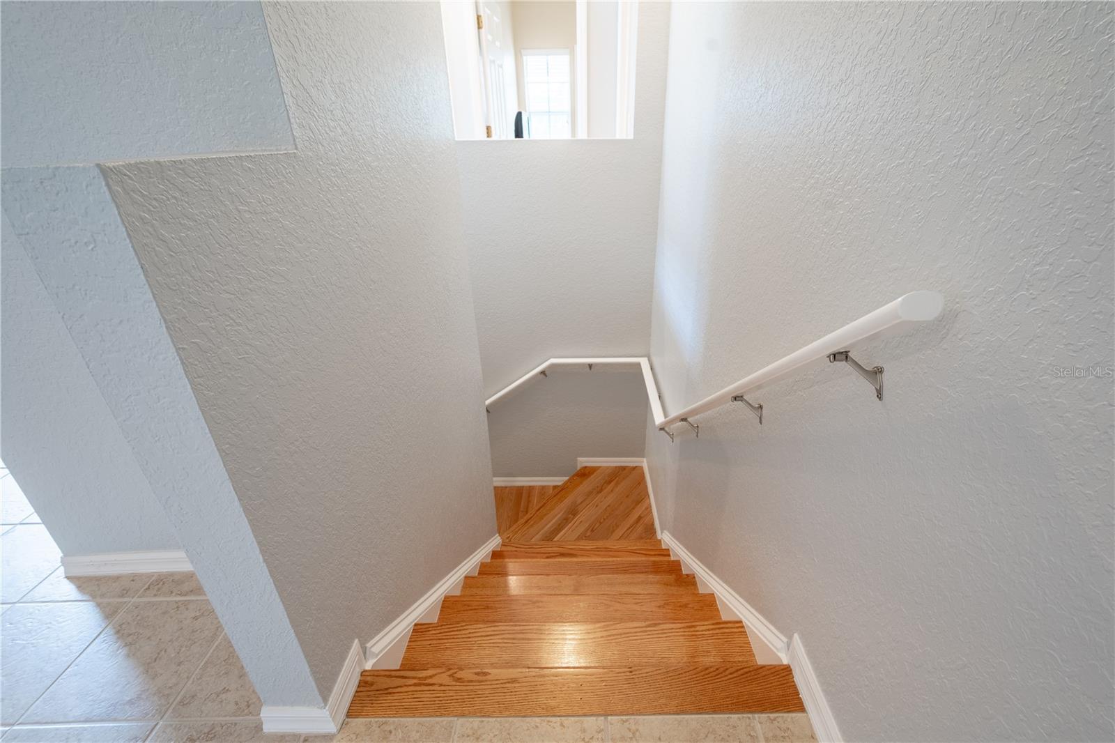 The stair feature wood flooring.