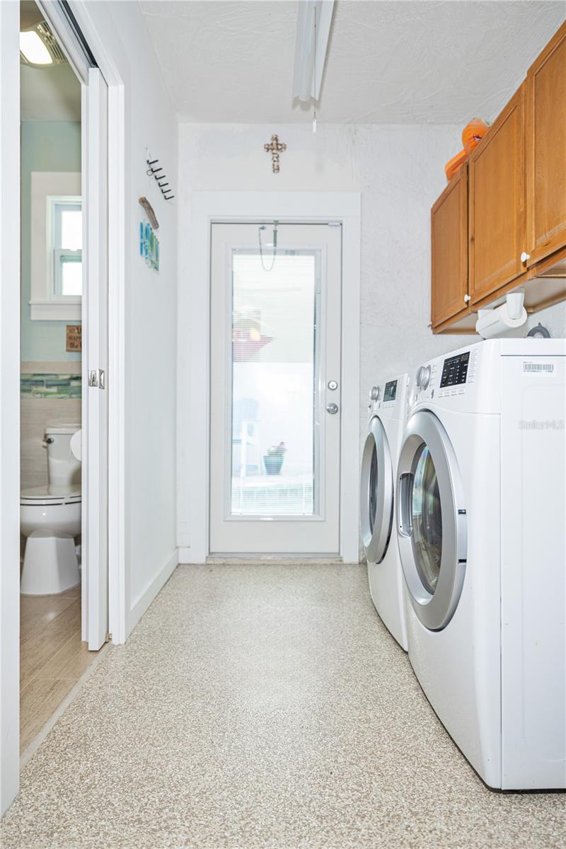 The garage is so clean...epoxy chip floors, mini-split for comfort while doing laundry or working at a workbench...and a large storage room for all your toys.