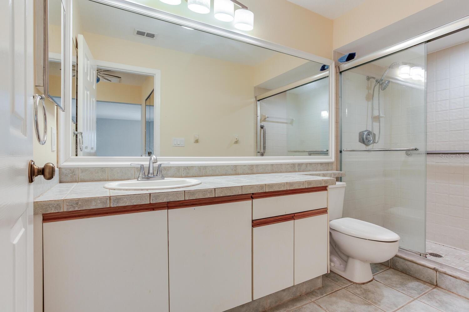 Primary Bath with linen closet and walk in shower