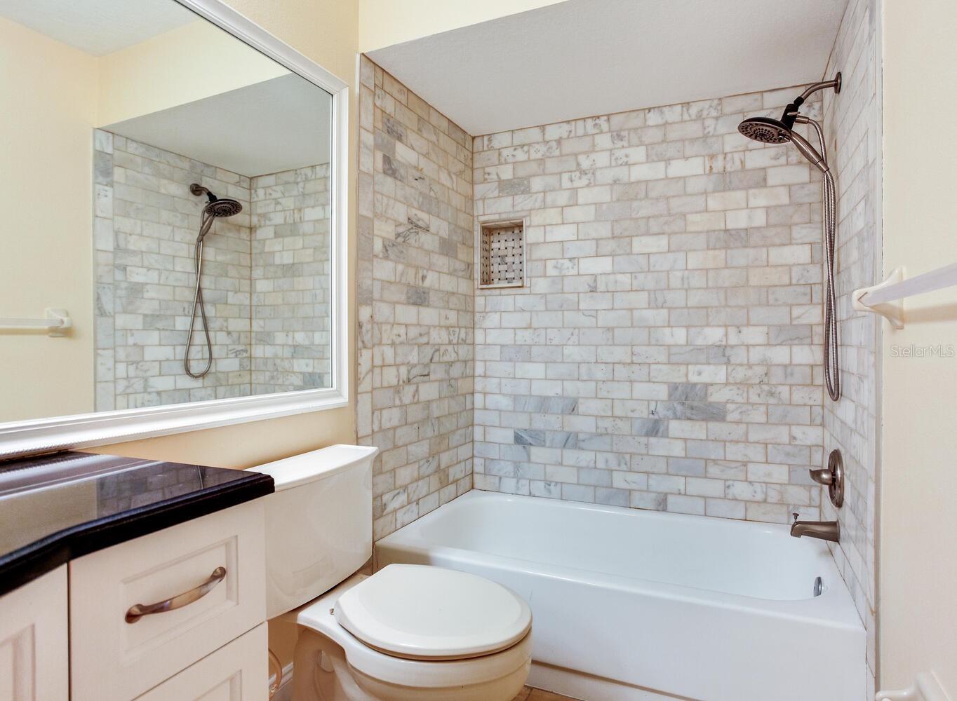 Second bath with tiled shower/tub