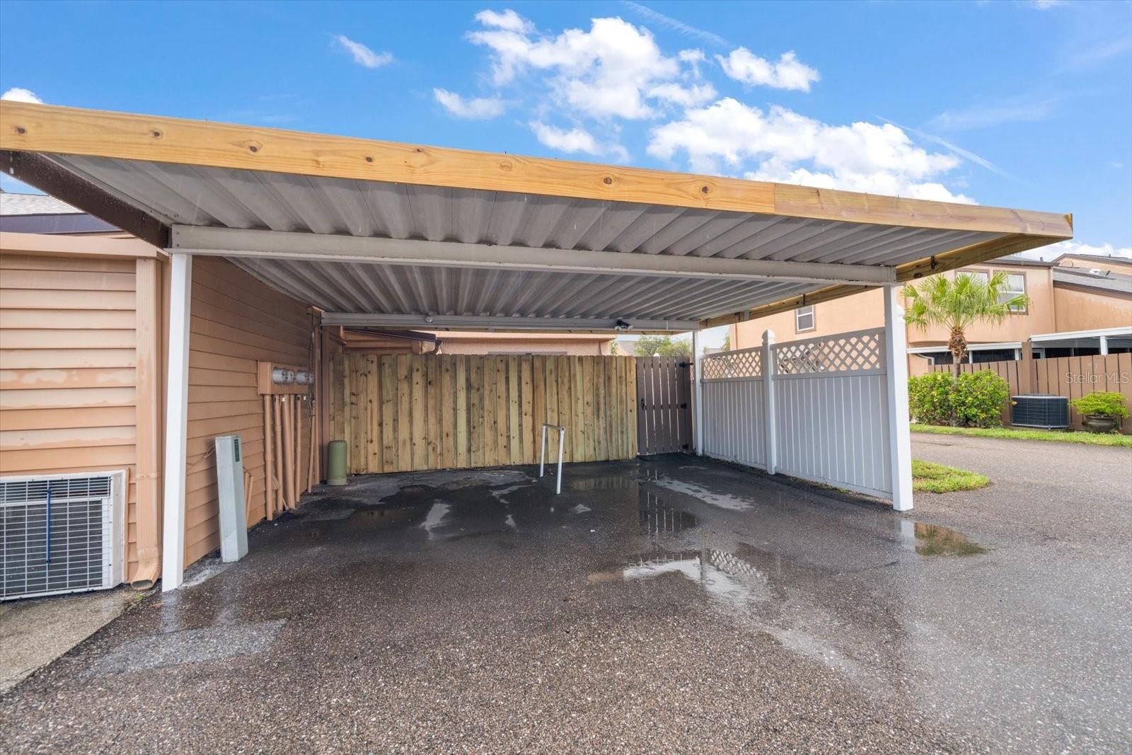 Carport - 1 spot on the right with access to back area