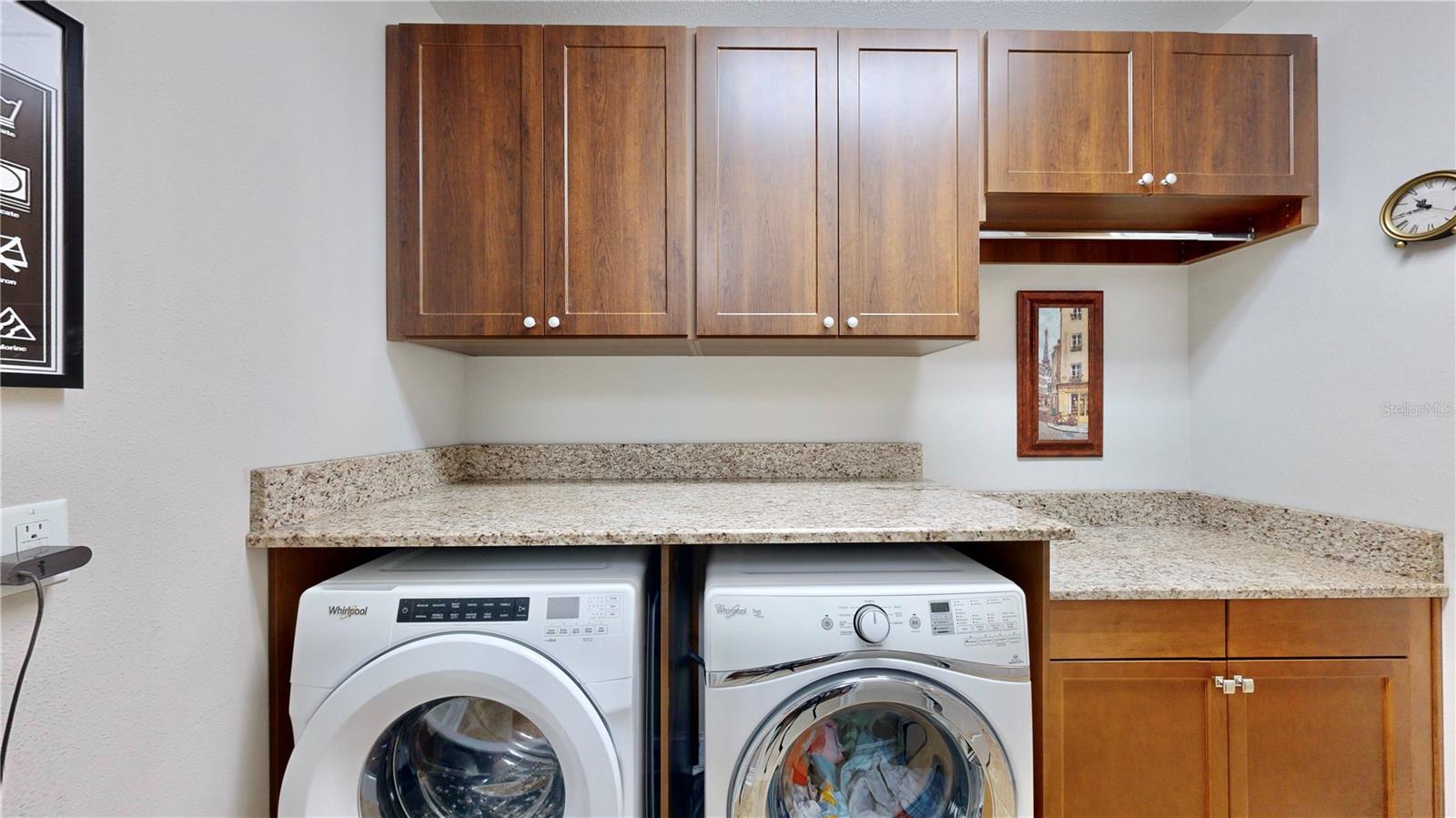 Laundry room with custom cabinets and plenty of counterspace