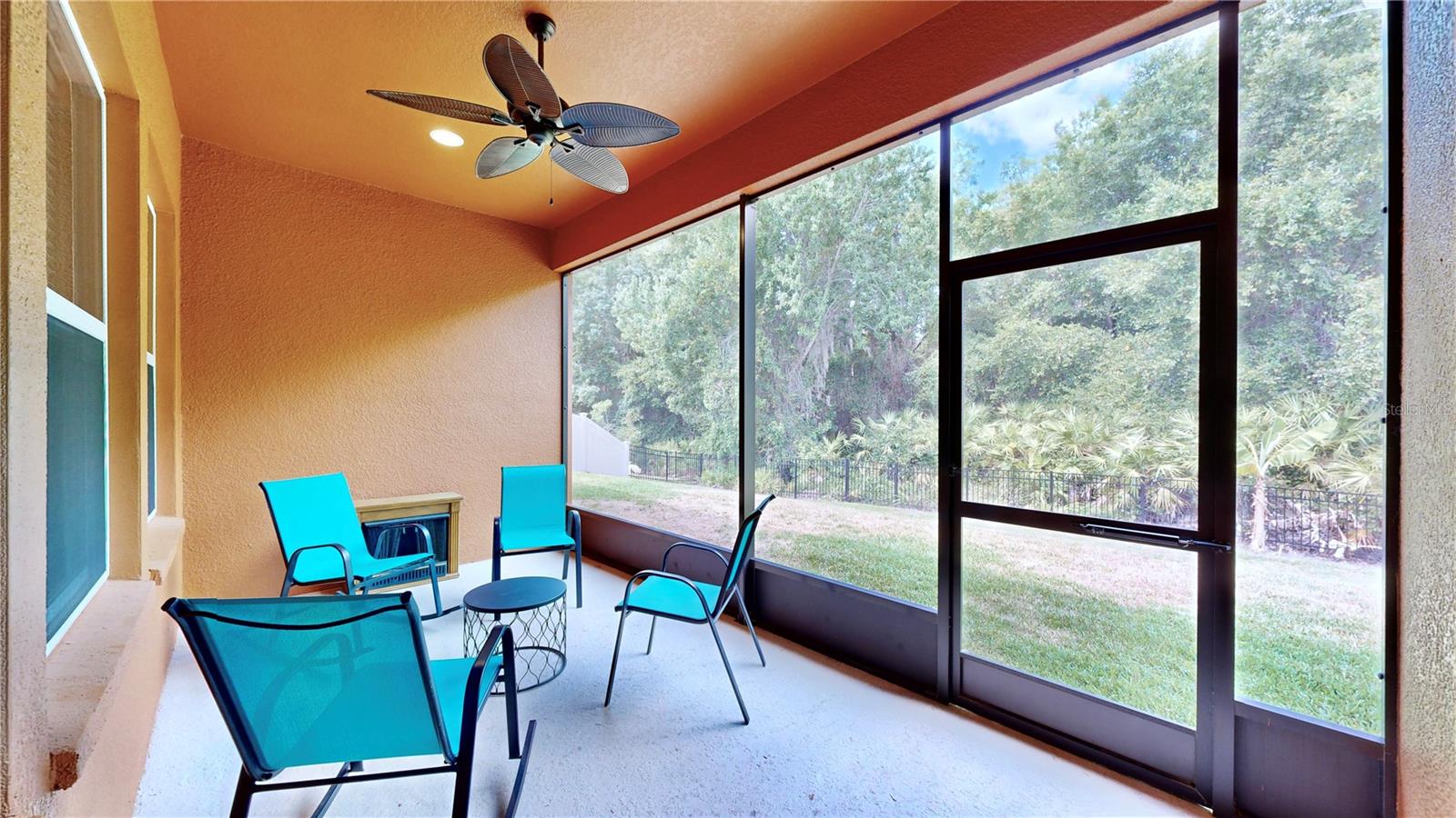 Large screened in lanai overlooking backyard