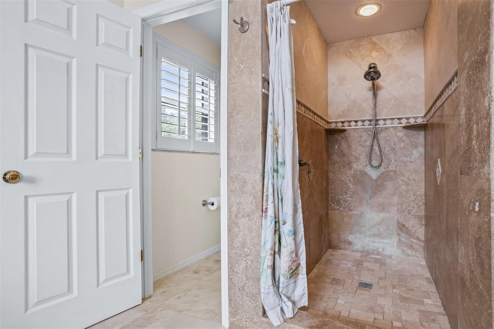 Walk in shower in primary suite