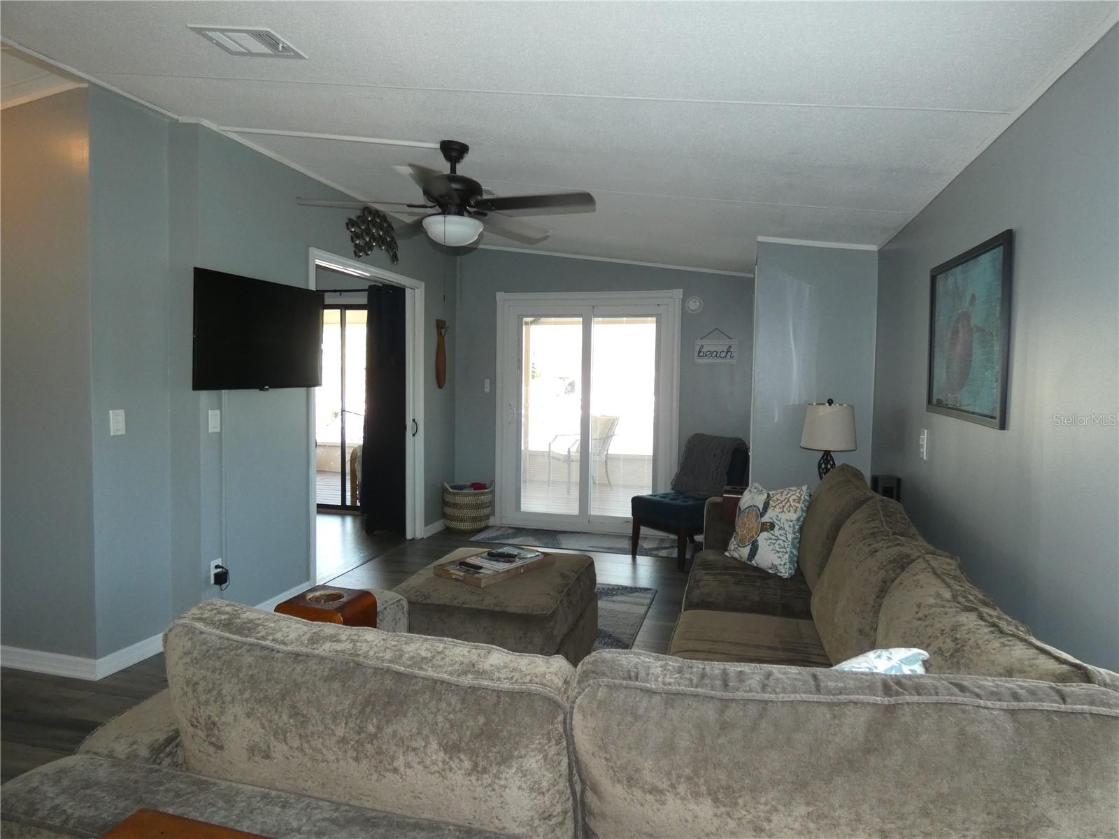 Living room overlooking the open water out the sliding doors.