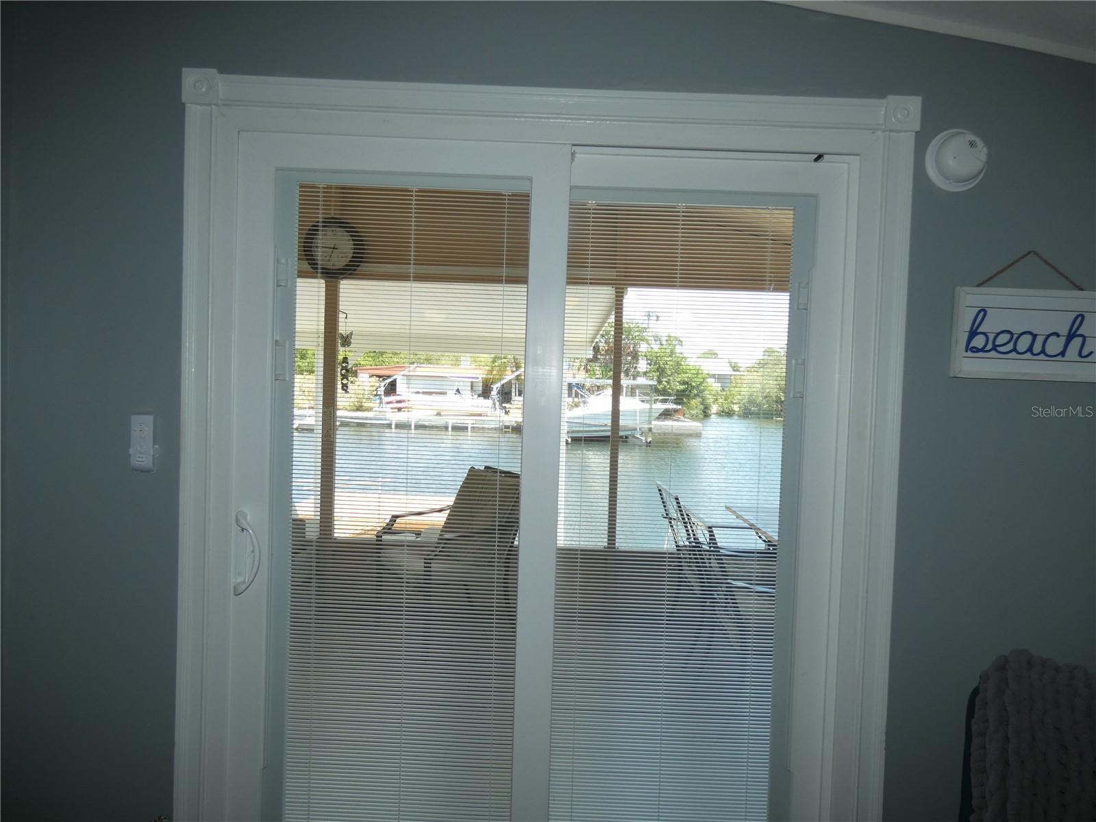 This view from the living room!  The heavy sliding door has the blinds installed inside of glass.