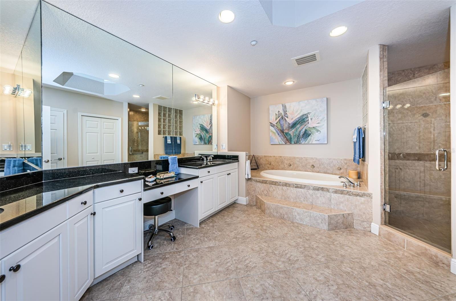 . Master Bathroom Suite Looking In.. This is a large 300 Sq Ft Bathroom Area with Two Walk in Closets in Hallway area.