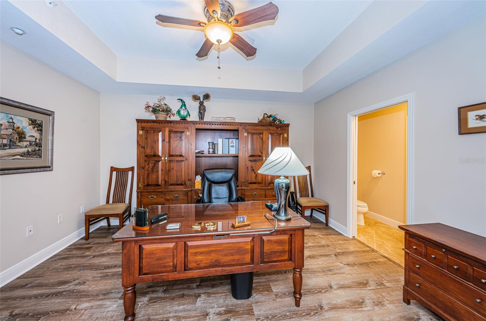 ..  11.8 W x 15' L ...Shot of Flex Room / Media Room / 4th Bedroom ? Looking in from Hallway. Half Bath on Right. Half Bath Also feeds the Common Area aka Kitchen & Living Room..