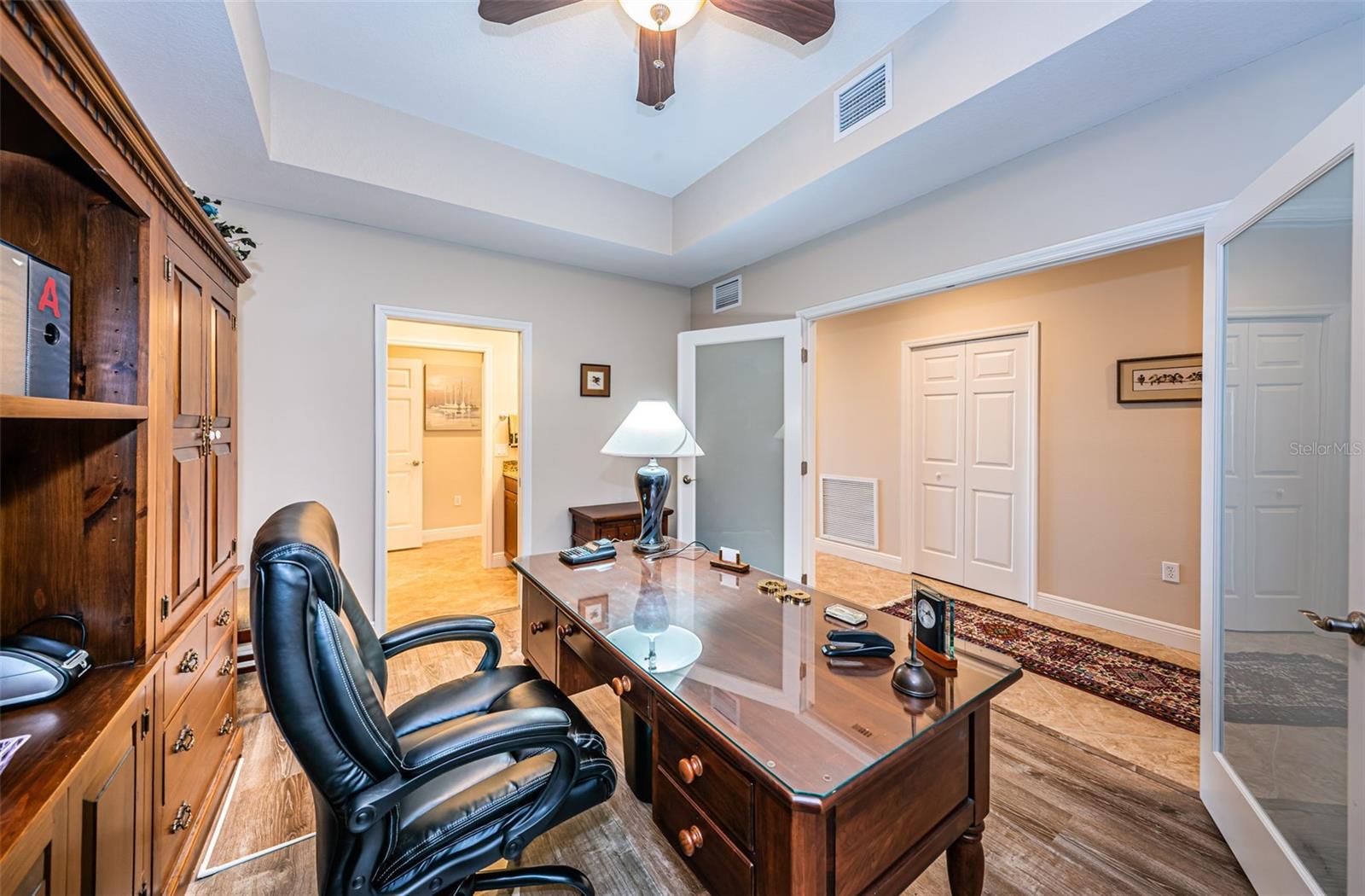 .. Shot of  11.8 x 15' Flex Room / Home Office .. Double Parlor Doors lead to Hallway. Open Door on Left leads to Half Bath.. In Hallway The Great Room & Water front will be to the Left.. Guest Bedrooms to the Right.