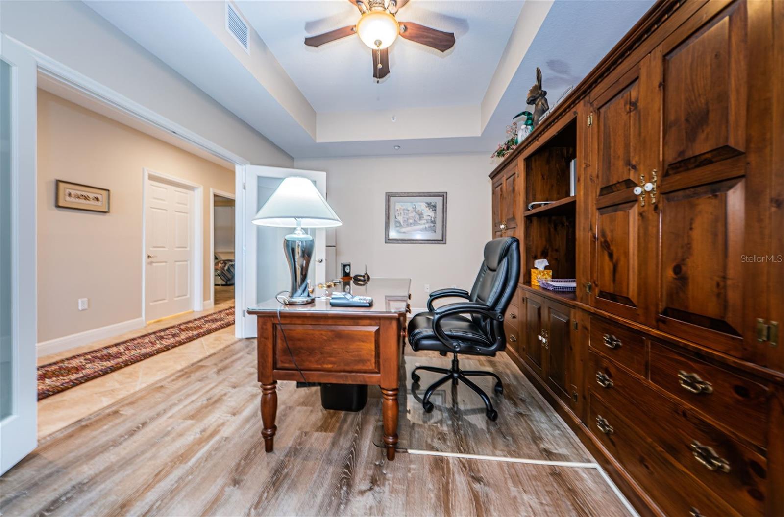 ... 12' x 15'  Flex Room / Home Office . Shot Taken from 1/2 Bath. This Transitional Space between the Front of the Condominium and the Rear Guest Bedrooms could be used as a 4 rth Bedroom if Desired..