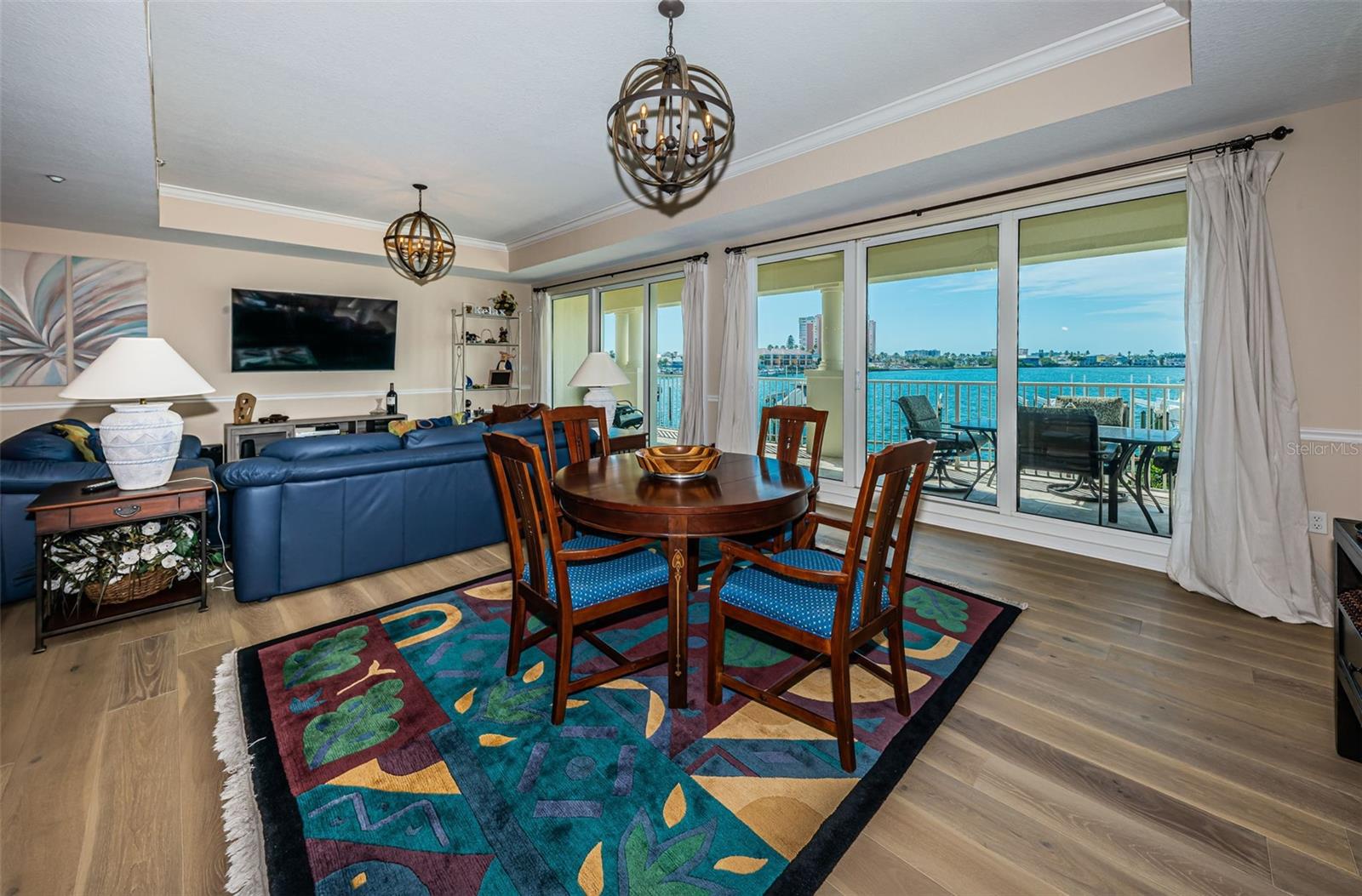 ... The La Bahia Great Room with it's High Ceilings And Sweeping Water views engage our Visual Attention. Nice Shot of the Wall of Glass Over looking Boca Ciega Bay...  Custom Window Treatments on all Sliders..