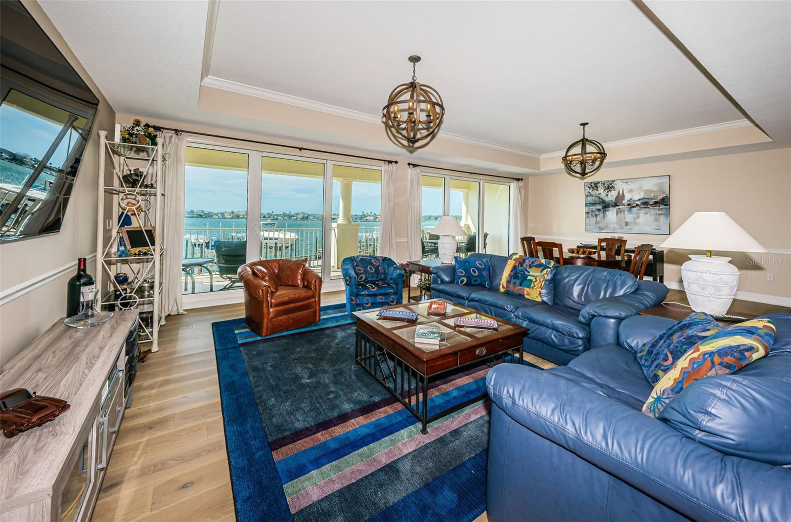 ...Shot # 7...  Lounging / Gathering Area in Great Room..  High Tray Ceilings Add An Aesthetically Pleasing Aura to the Home. The Boat Docks and the Open Water Views of Boca Ciega Bay Complete the Ambience.