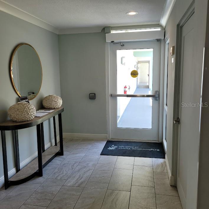 Closer look at the door and sign in table. Out to the left of this door will be the access door to the storage area. Each unit is assigned a floor to ceiling unit to store things.