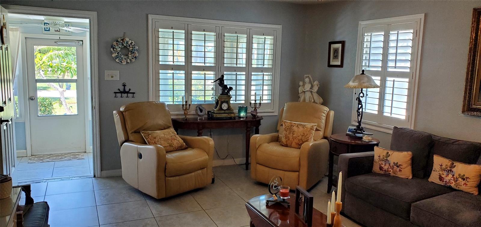 Living Room and Front Entry,  Bahama shutters on  all interior windows