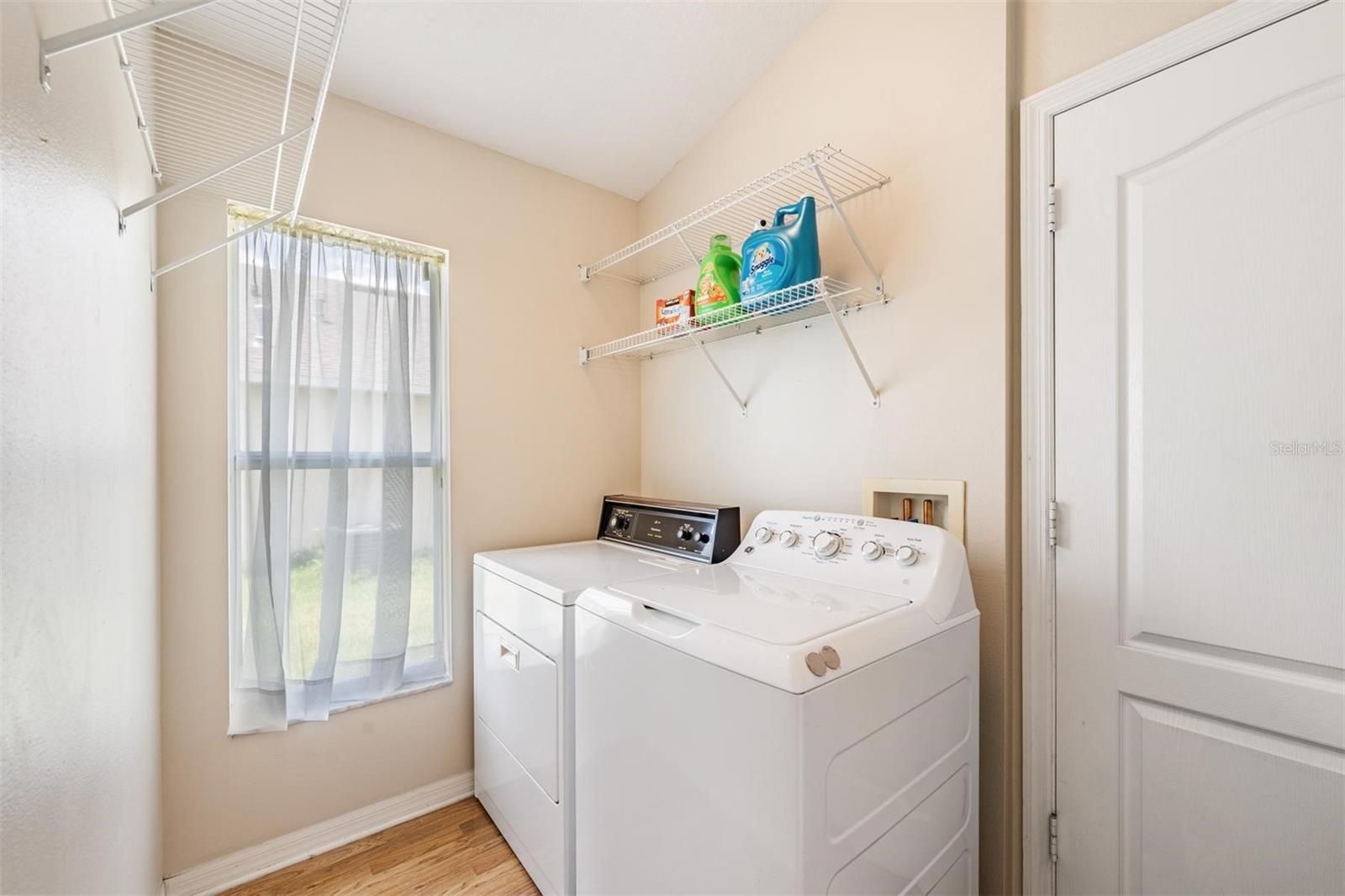 Laundry room off kitchen and garage