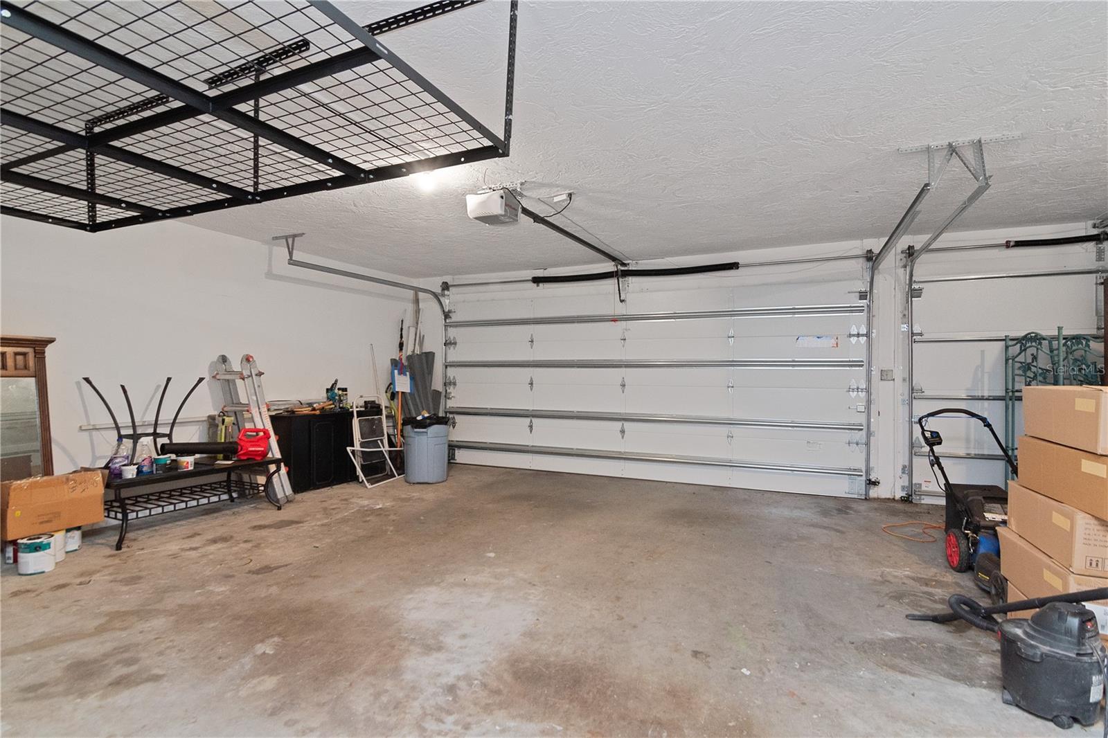 Oversized 3-Car Garage featuring Storage Racks