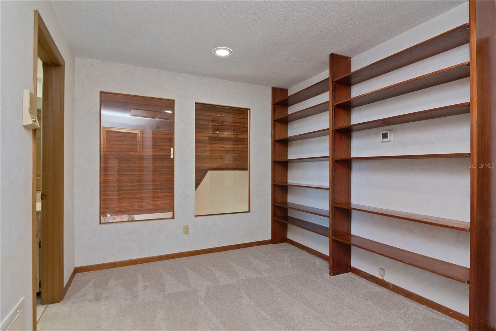 Bonus Room/Office has interior windows to Vaulted Ceiling - lets in natural light! Featuring New Paint, New Carpet,  and Built-In Shelves. Thermostat 2019