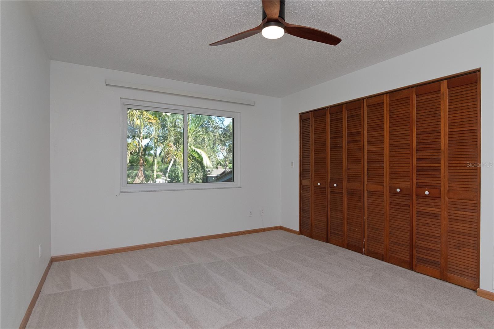 Upstairs Bedrooms feature New Lighted Ceiling Fans, New Paint, New Carpet, and Hurricane-Rated Windows