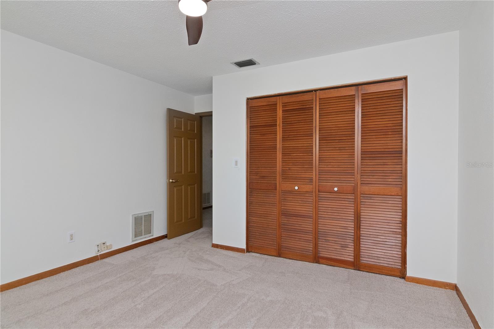 Upstairs Bedrooms feature New Lighted Ceiling Fans, New Paint and New Carpet.