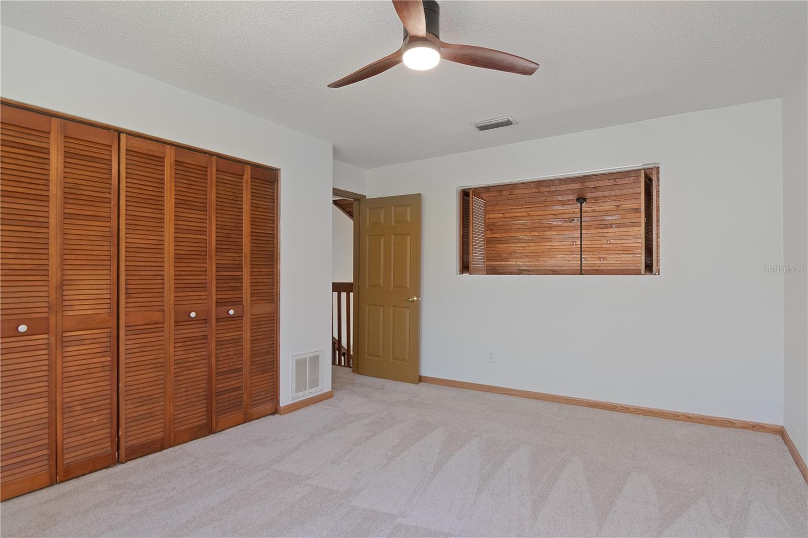 Upstairs Bedrooms feature New Lighted Ceiling Fans, New Paint and New Carpet.