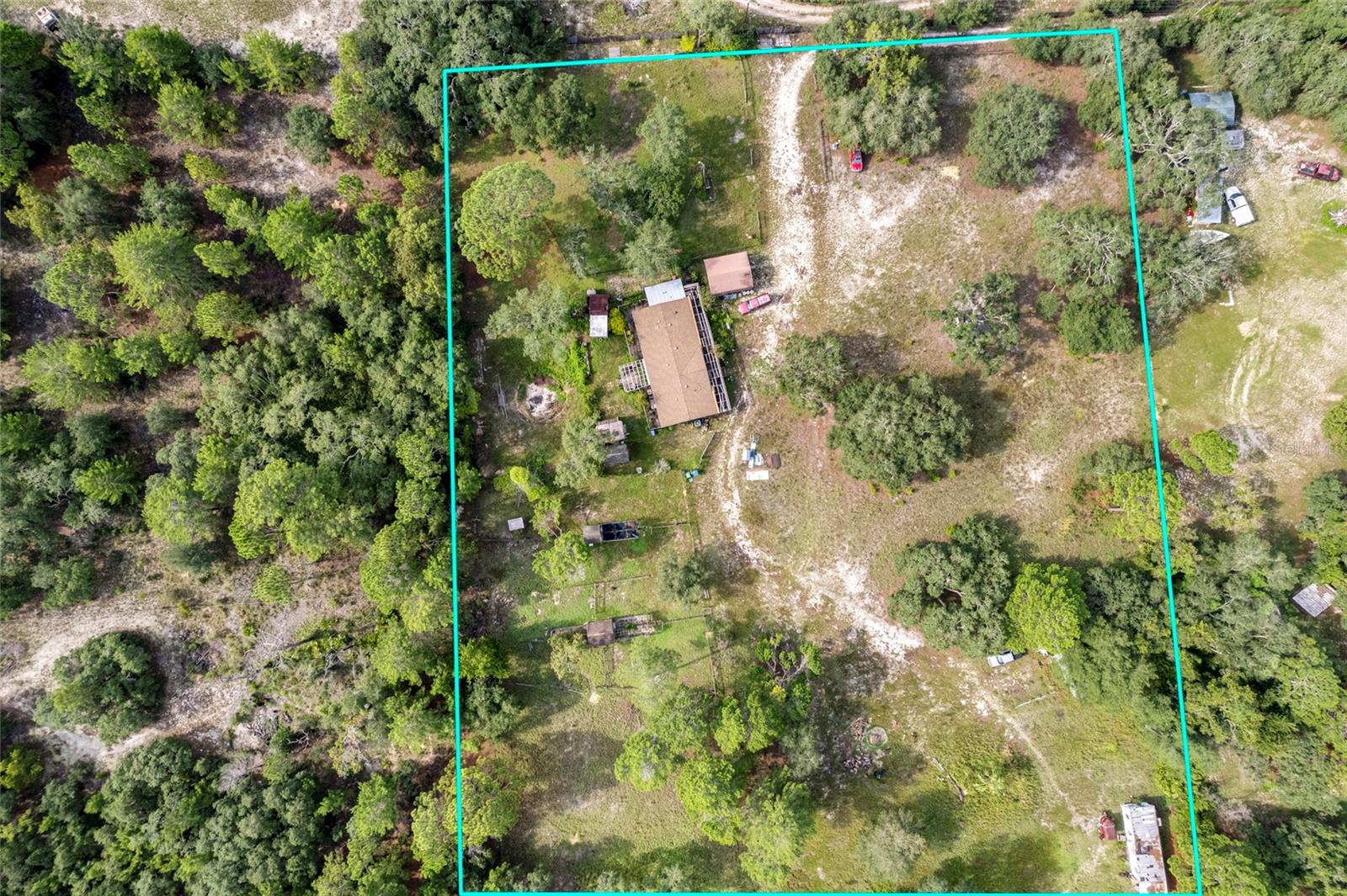 Blue property lines are approximate and should be verified by a survey.