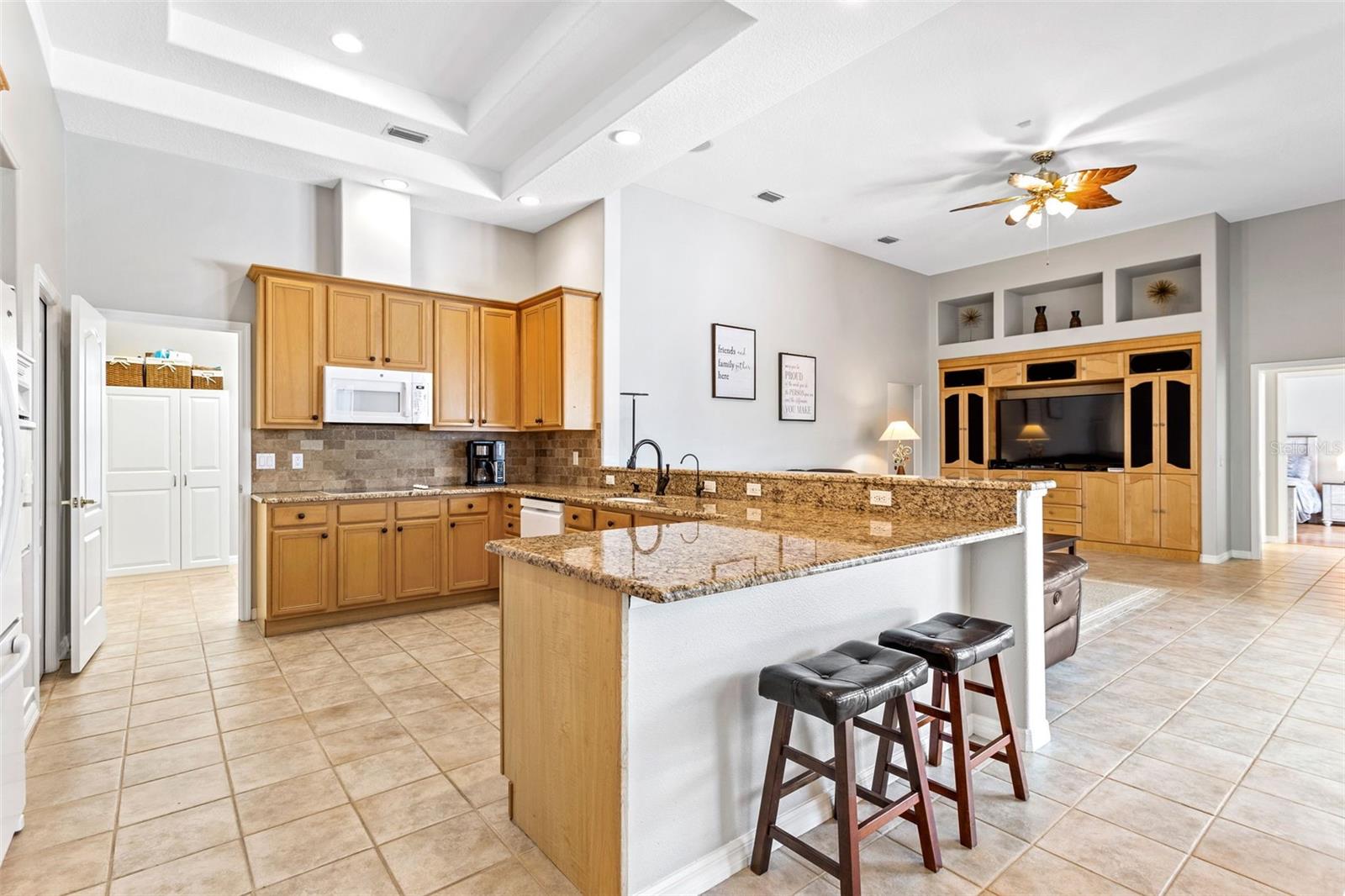 Kitchen with view to family room and secondary bedrooms