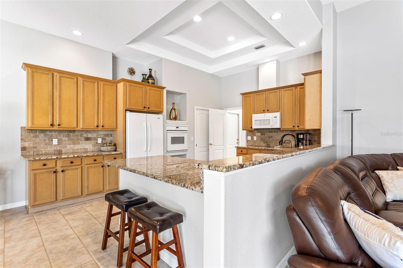 Kitchen with view to laundry room and garage access