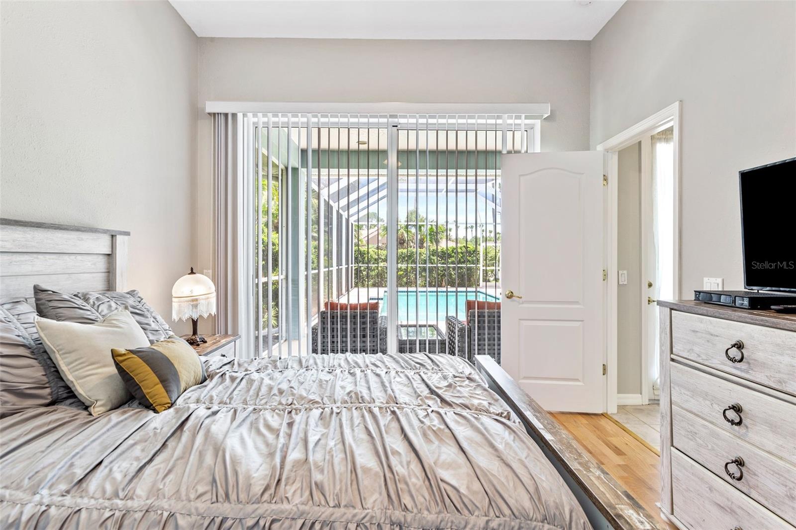 Bedroom 4 with access to separate bath and pool lanai.