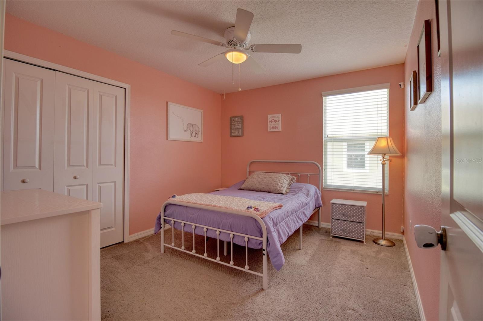 Bedroom 5 features custom closet shelving and a ceiling fan.