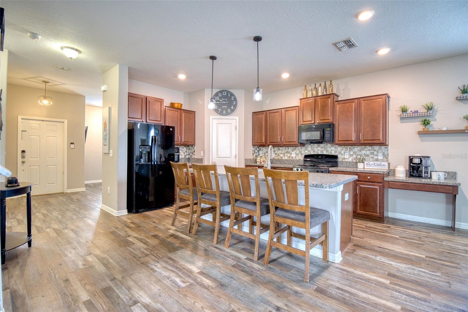 Abundant Storage ensures a clutter-free and organized space. The custom cabinetry, spacious walk in pantry, and well-placed drawers offer ample room to keep all your kitchen essentials within easy reach.