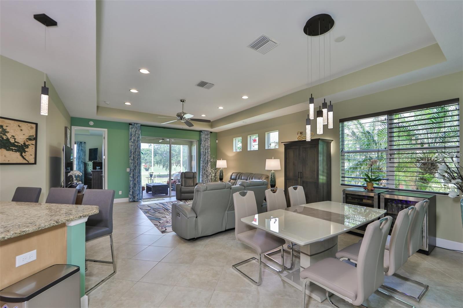 The view from the kitchen, is exquisite. Large double sliding glass doors and multiple windows allow Florida sunshine to filter through out the home.