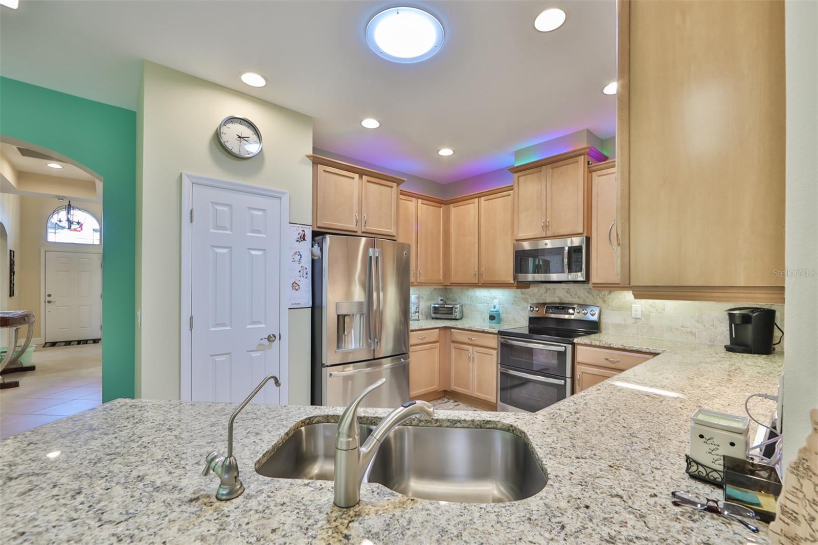 Granite counters, 42" solid wood cabinetry and NEW, HIGH-END appliances.  Notice the solar tube in the center of the kitchen, which provides a great source of natural light.