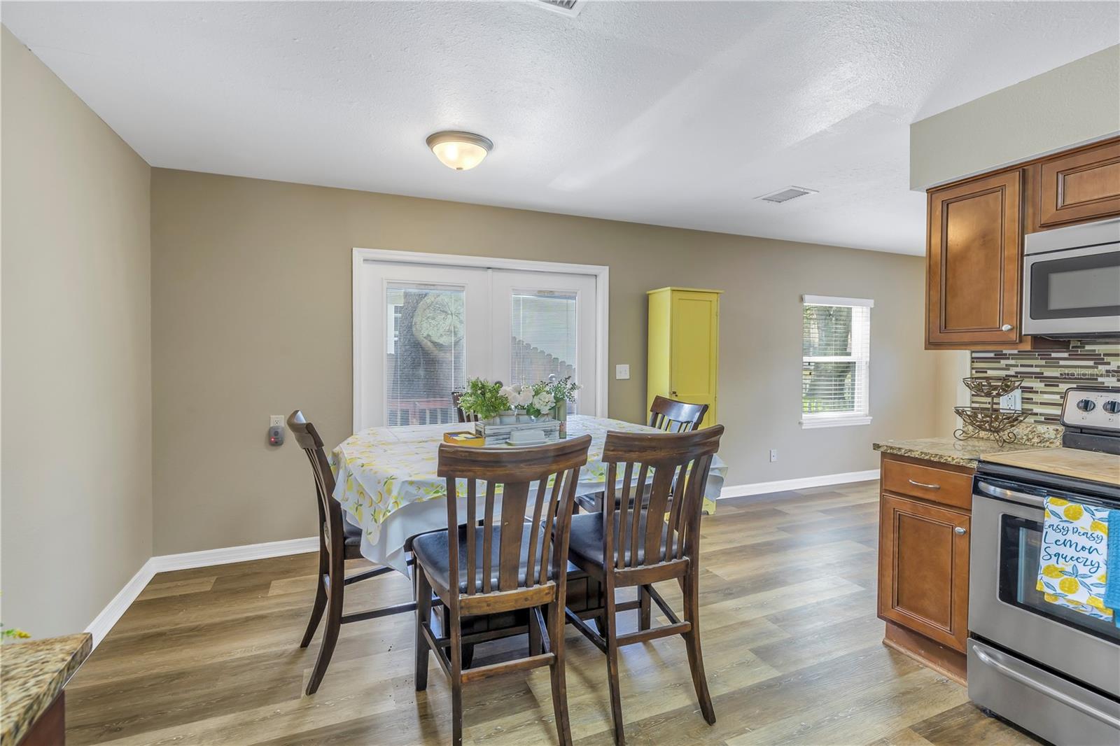 Kitchen/dining, French doors to side deck