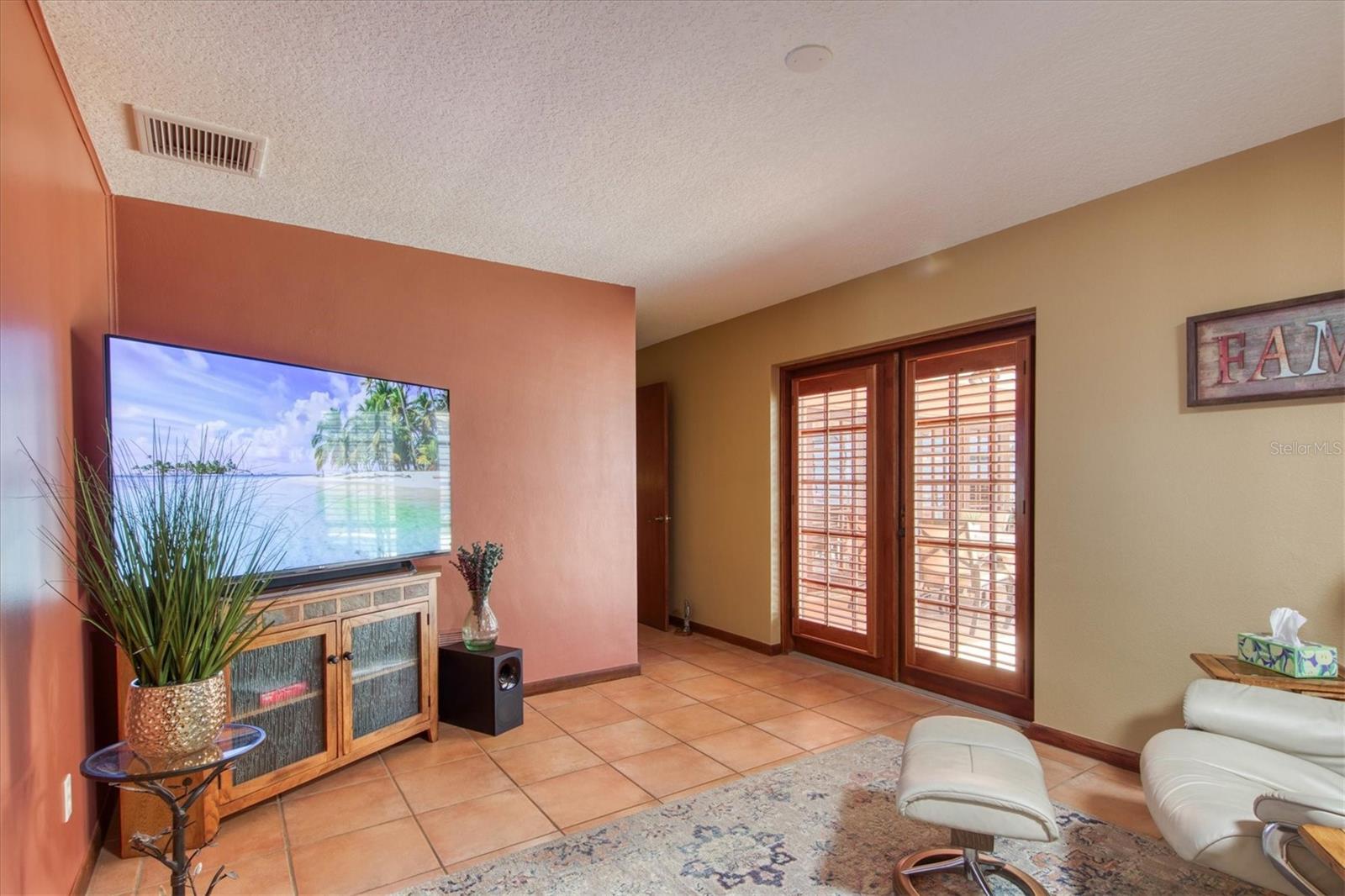 Bonus room with French doors leading to pool