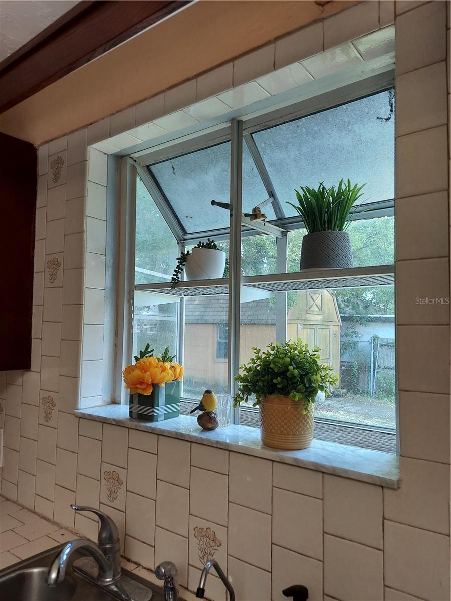 Atrium window above kitchen sink